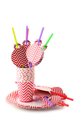 Paper cups with plates and tubules isolated on white