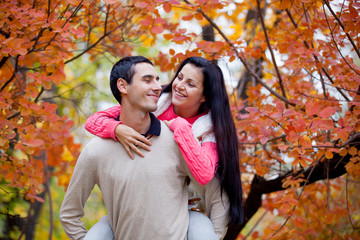 photo of cute couple hugging on the wonderful yellow trees background