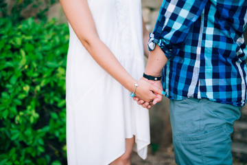 The newlyweds hold hands. Couple holding hands. Wedding in Montenegro.