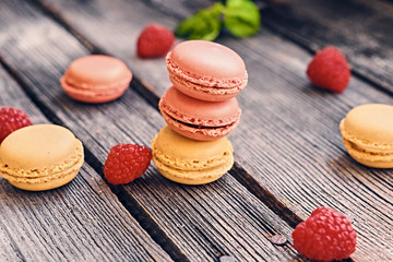 Delicious, colorful cookies on a grey wooden table.