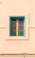 Fototapeta na wymiar Arabic style windows in Marrakesh. Front elevation architecture