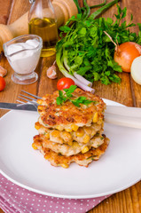 Chicken fritters with corn, onions and fresh herbs