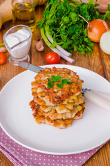 Chicken fritters with corn, onions and fresh herbs