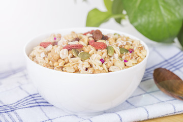 Healthy breakfast berry food topped with goji berries,raspberry, pumpkin.