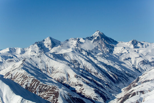 Beautiful winter landscape with snow-topped mountains. Ski resort