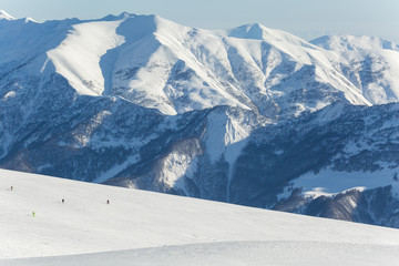 Beautiful winter landscape with snow-topped mountains. Ski resort