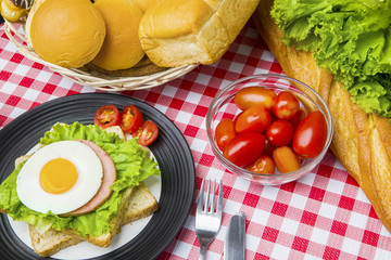 Fried egg with breads and tomatoes
