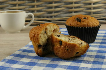 Chocolate muffins with a Cup of coffee on the table