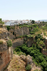 Fototapeta na wymiar Spain. Andalucia. Ronda. White houses on the rock vertical view.