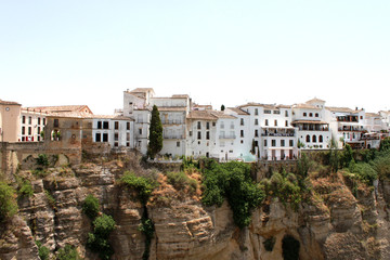 Obraz premium Spain. Andalucia. Ronda. White houses on the rock on blue sky background. Horizontal view.