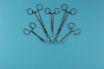 Surgical Instruments on blue background.