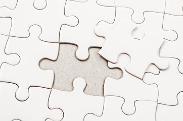 Obraz premium White jigsaw puzzle.