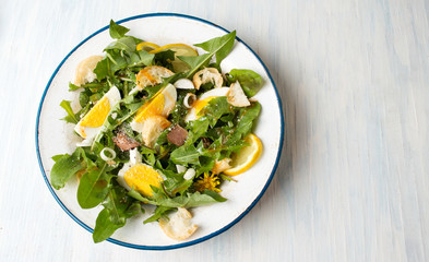 Dandelion leafs meal salad on a plate