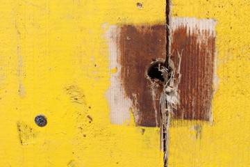 old yellow painted wooden background