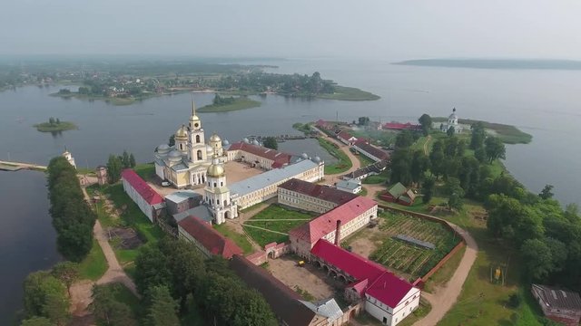 Aerial panorama view on Nilo-Stolobensky (Nil) deserts - Orthodox monastery and the lake Seliger, Tver region, Russia, 4k
