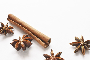 anise star with cinnamon stick background