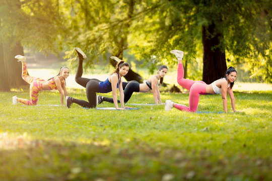 Young Women Exercising In Nature