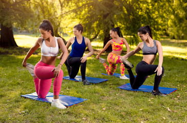 Young Women Exercising In Nature