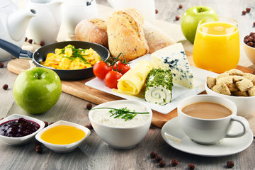 Breakfast served with coffee, cheese, cereals and scrambled eggs