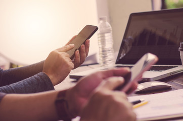 Fototapeta premium Team businessmans job . working with laptop in open space office. Meeting report in progress. sun glare effect