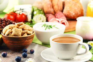 Breakfast served with coffee, cheese, cereals and scrambled eggs
