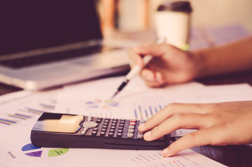 Fototapeta premium Businessman are working with a calculator and laptop. in office business concept