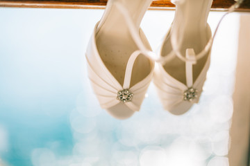 Wedding shoes of the bride at a window. Wedding in Montenegro