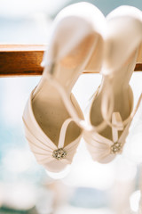 Wedding shoes of the bride at a window. Wedding in Montenegro