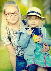 Mother and daughter in park.