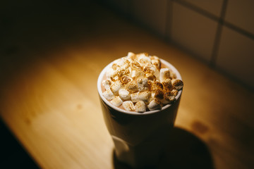 cocoa with marshmallows in a white Cup in a cafe
