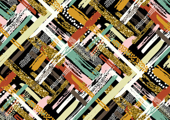Obraz premium Vector seamless pattern with hand drawn gold glitter textured brush strokes