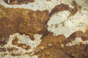 Texture of natural stone with shades of rust