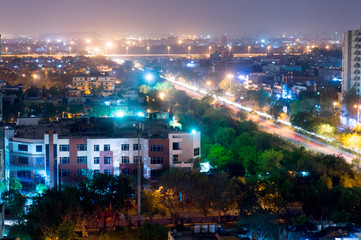 Fototapeta premium Noida cityscape at night showing lights, buildings and residences. Shows the urbanization and development of Delhi