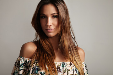 spanish woman with long straight hair watching in camera