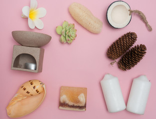Aromatherapy  product  Spa set ,candle ,soap,coconut,flower,shell,  massage  with  pink color   background .