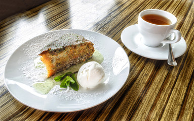 Carrot cake and a cup of tea on the table