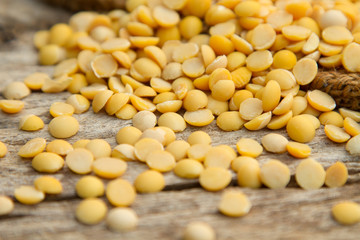 Fototapeta na wymiar Soybean, Close up heap of peeled soy on wooden table