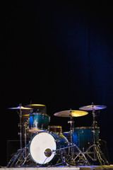 Fototapeta na wymiar Drum Set On A Stage At Dark Background. Musical Drums Kit On Stage