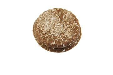 Chocolate cookies with coconut shaving isolated on white background