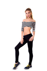 Sporty blonde girl in leggings and striped T-shirt