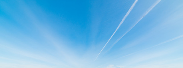 contrails and blue sky