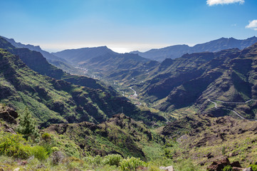 Naklejka premium Mountain landscape in Gran Canaria: Barranco de Mogan and GC-200 road.