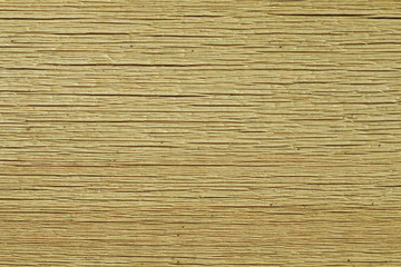 Texture of the dry cracked board a light beige background