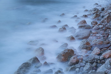 Boulders in the sea during a storm