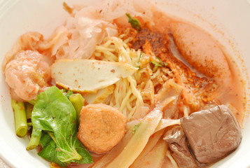 Chinese egg  noodles with shrimp and fish ball in red soup Chinese-language called Yong Tau Fu