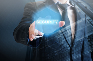 Double exposure of professional businessman touching security hexagonal polygon button on a digital interface and city of business background in business and security technology choices concept