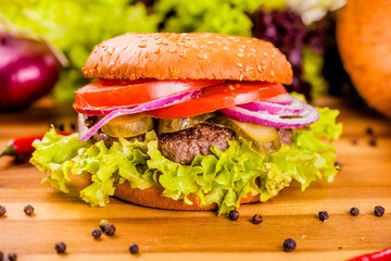 Hamburger on wooden cutting board