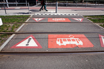 streetcar warning signs on pavement