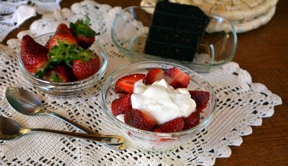 Healthy greek yogurt with chopped fresh strawberry for breakfast.