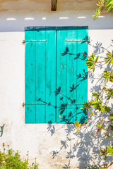 Old blue wooden window. Photo from Zakynthos Island, Greece.